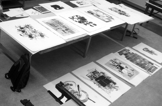 Large black and white prints on the table and the floor.
